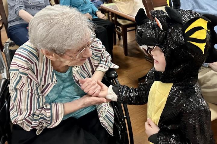 Nola visits with a child from the Presbyterian Day School.